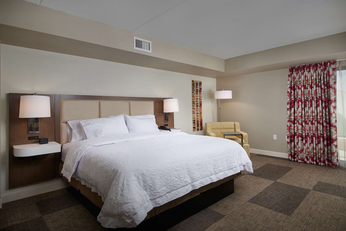 suite, 1 king bed, refrigerator & microwave (wet bar) | blackout curtains, iron/ironing board, free cots/infant beds