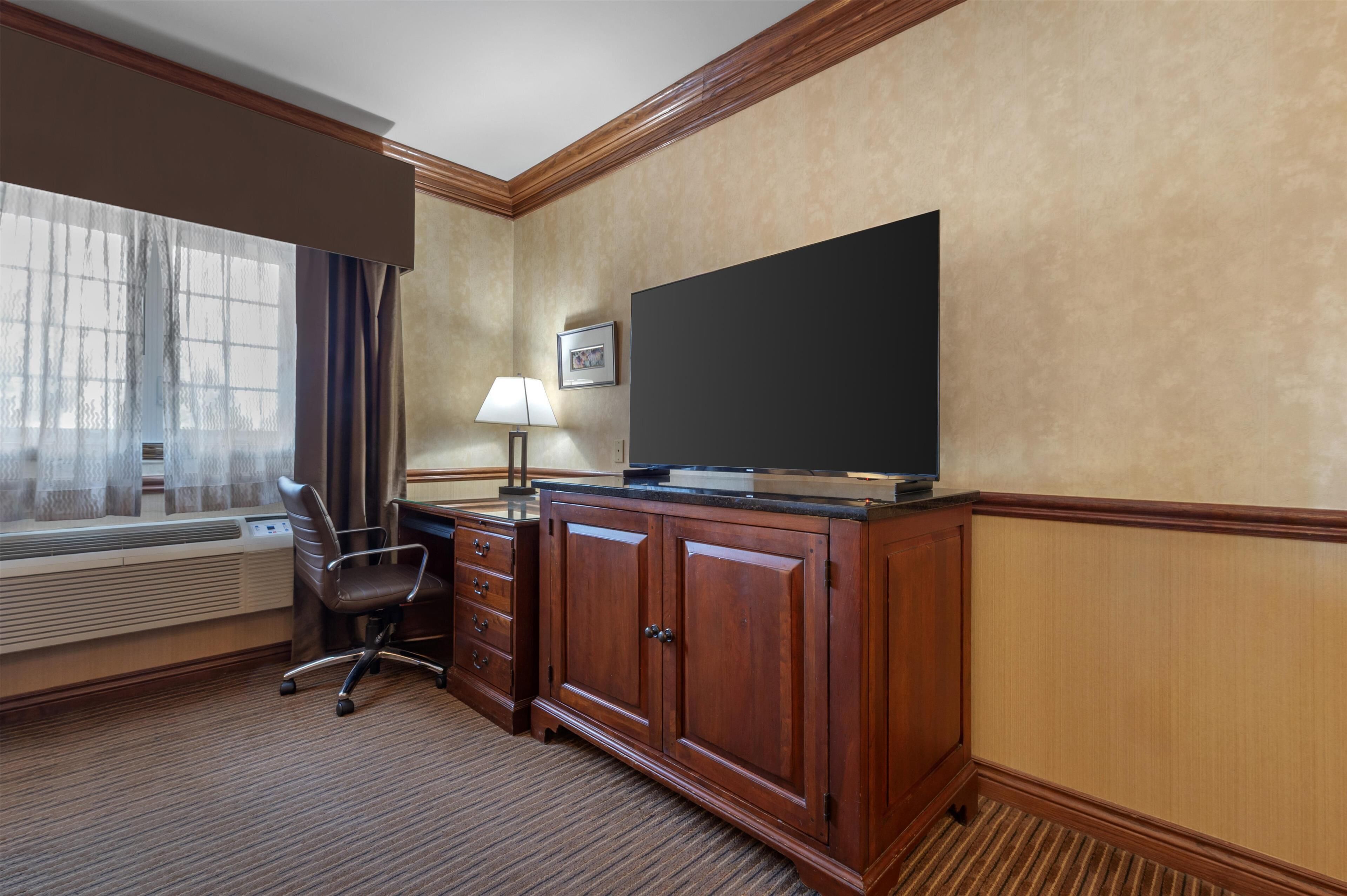 premium bedding, desk, laptop workspace, blackout curtains