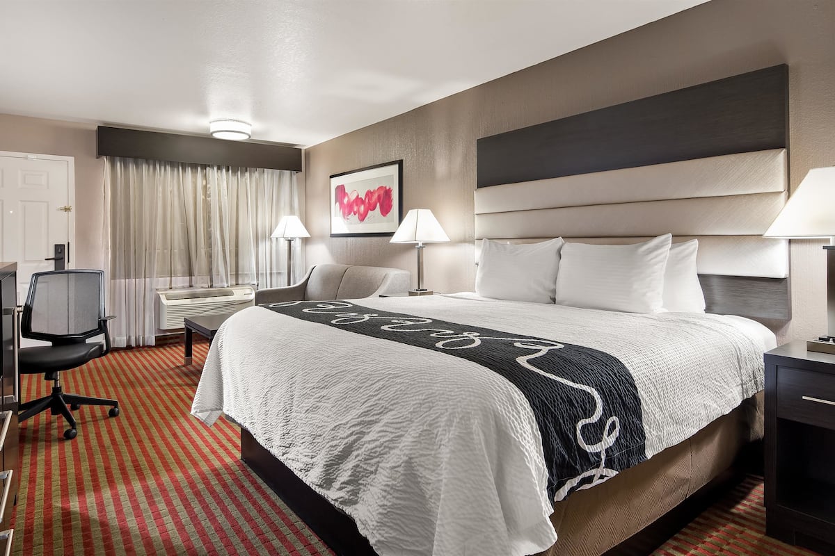 premium bedding, desk, blackout curtains, iron/ironing board