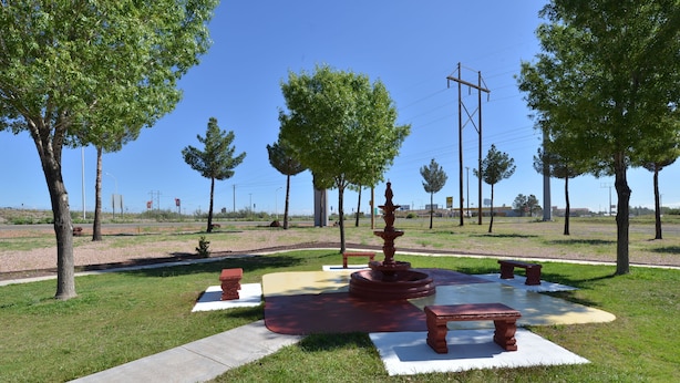 A park with a central fountain, benches, and a paved walkway. - Best Western Deming Southwest Inn (Deming)