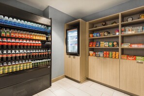 A vending area with various beverages and snacks. - Holiday Inn Boone - University Area by IHG (Boone)