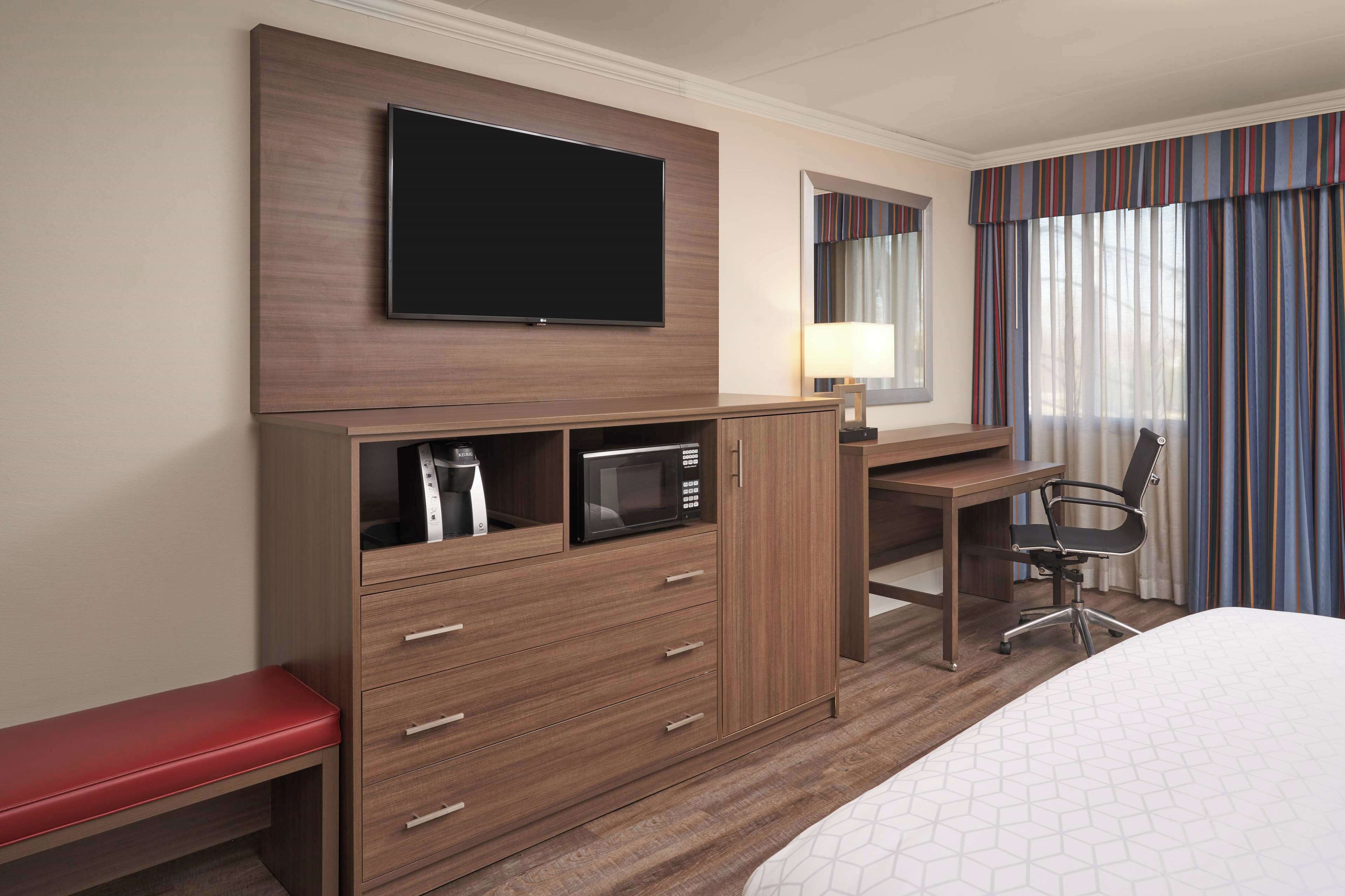 desk, laptop workspace, blackout curtains, iron/ironing board