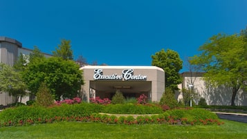 An Executive Center building with a landscaped garden in front.