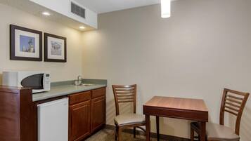 Desk, laptop workspace, blackout drapes, iron/ironing board