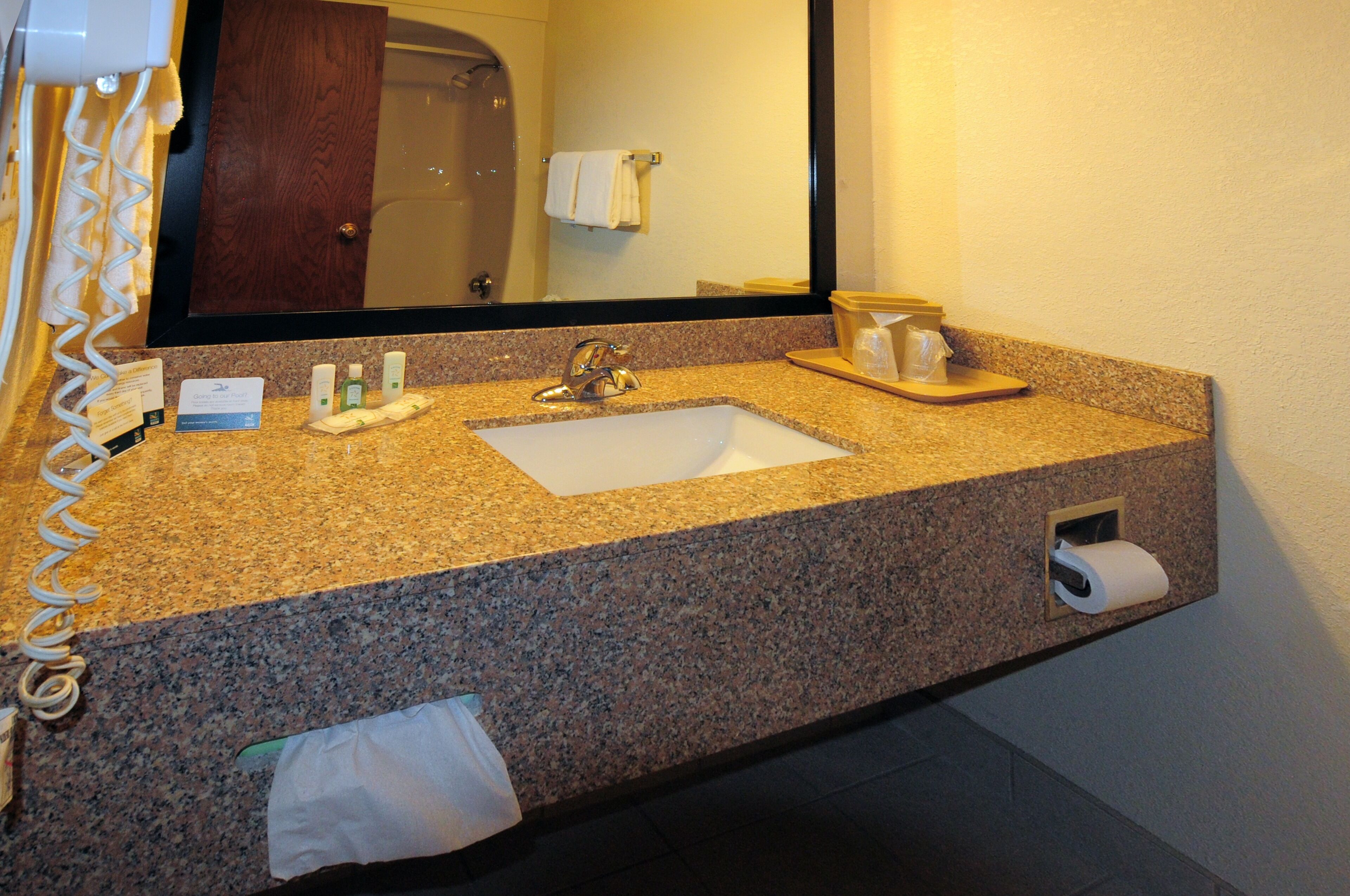 bathtub, deep-soaking bathtub, hair dryer, towels