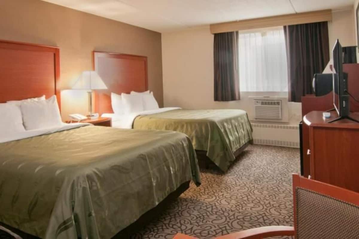 Down comforters, desk, blackout drapes, iron/ironing board