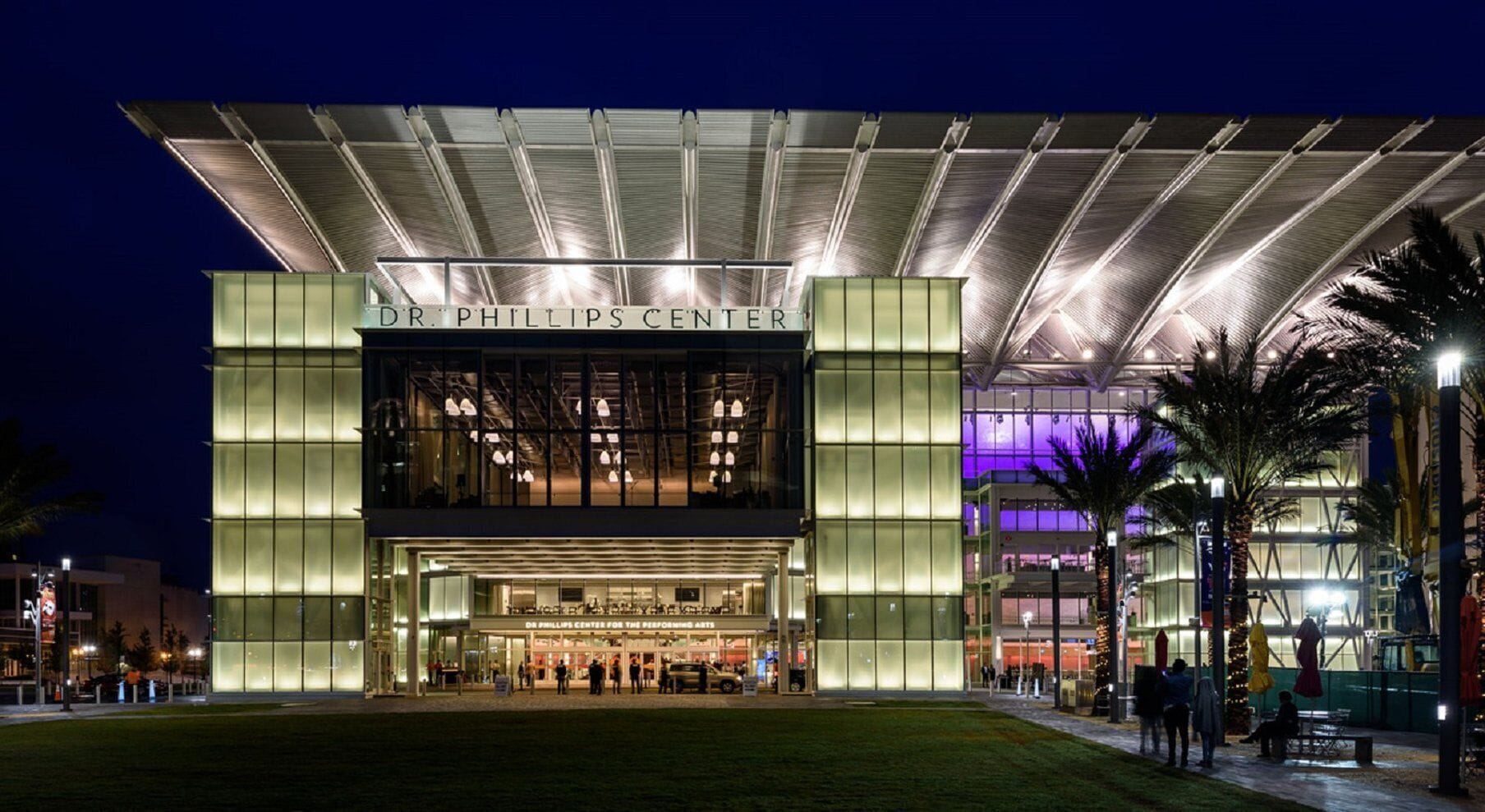 The Dr. Phillips Center with a modern architectural design, featuring a prominent entrance and a covered area.