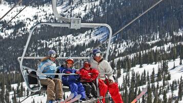 A ski lift with passengers.