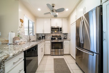 Full-size fridge, microwave, oven, stovetop at Kapalua Villas Maui