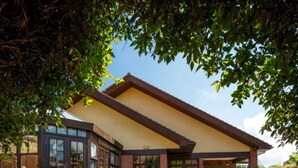 A building with a covered patio area, brick walls, and large windows. - Dragonfly Hotel King's Lynn (King's Lynn)