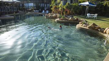 Outdoor pool, pool umbrellas, sun loungers