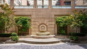 A courtyard with a central fountain, surrounded by stone steps and greenery. - The Westin Georgetown, Washington D.C. (Washington)