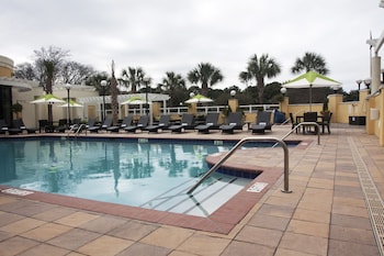 Outdoor pool, open 8 AM to 10:00 PM, pool umbrellas, sun loungers at Charleston Marriott