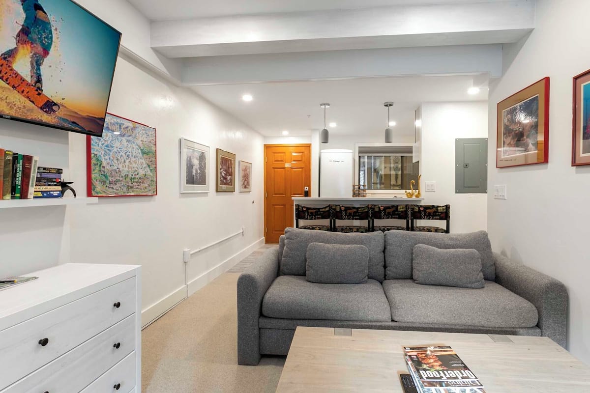 Deluxe Condo | Living area | 24-inch Smart TV with satellite channels, TV, fireplace
