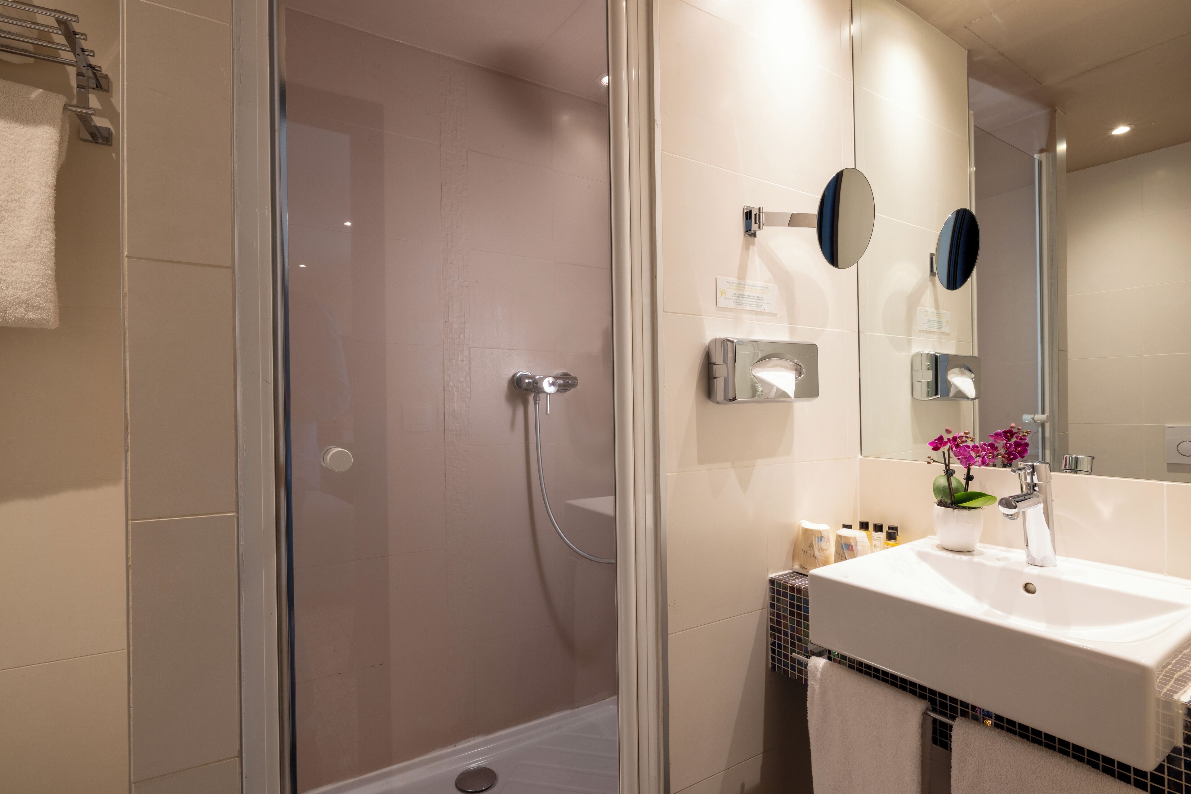 combined shower/bathtub, designer toiletries, hair dryer, bathrobes