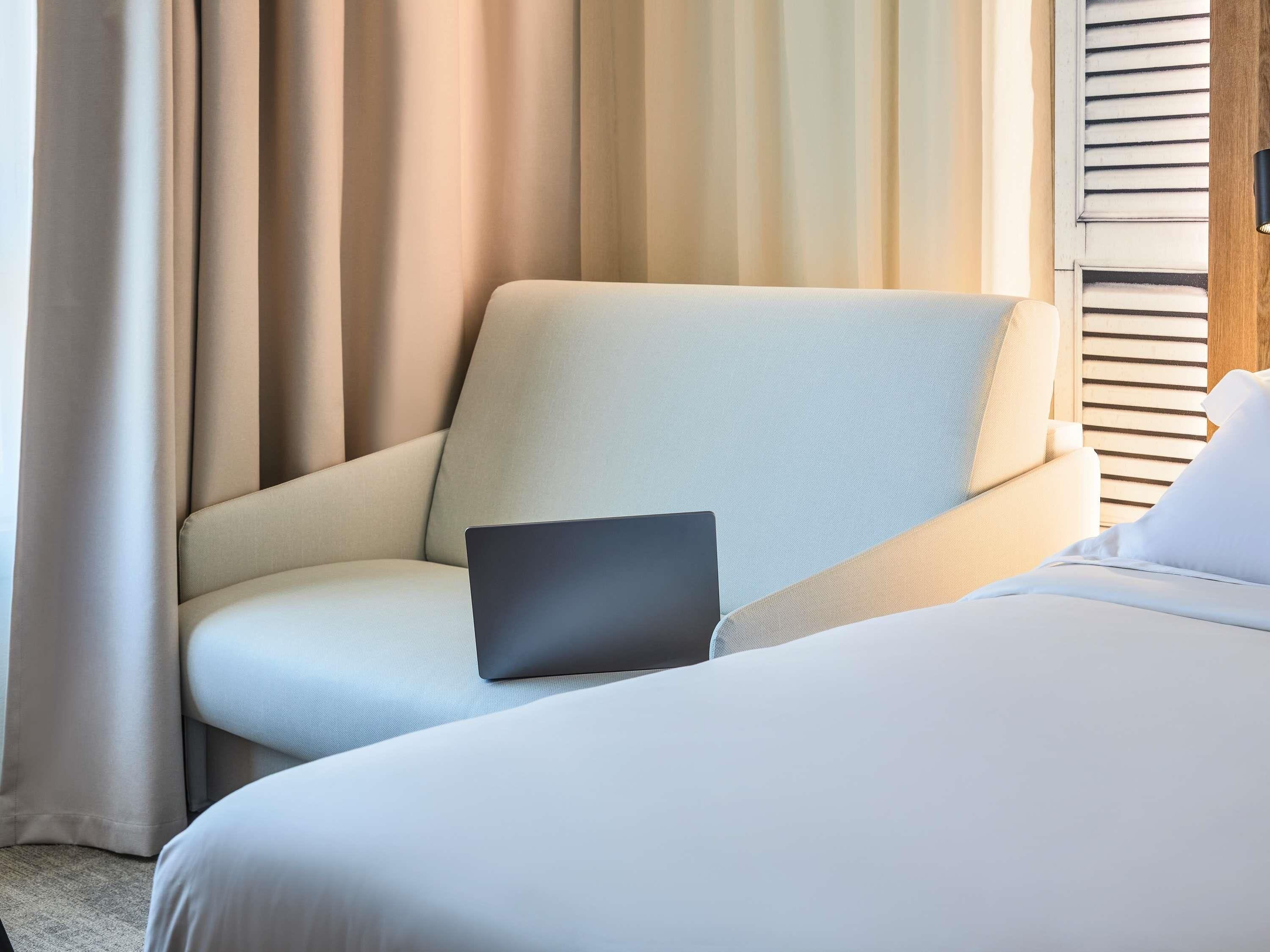 Individually furnished, desk, laptop workspace, blackout drapes