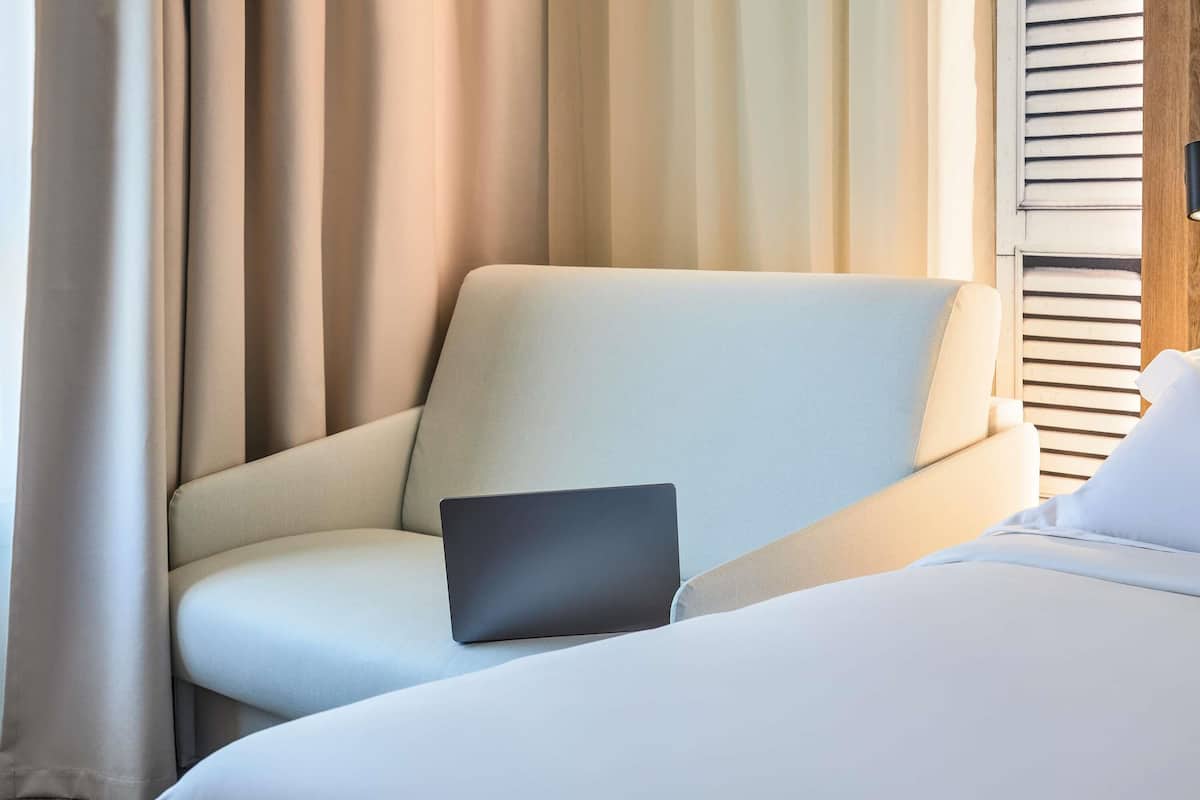 Individually furnished, desk, laptop workspace, blackout drapes