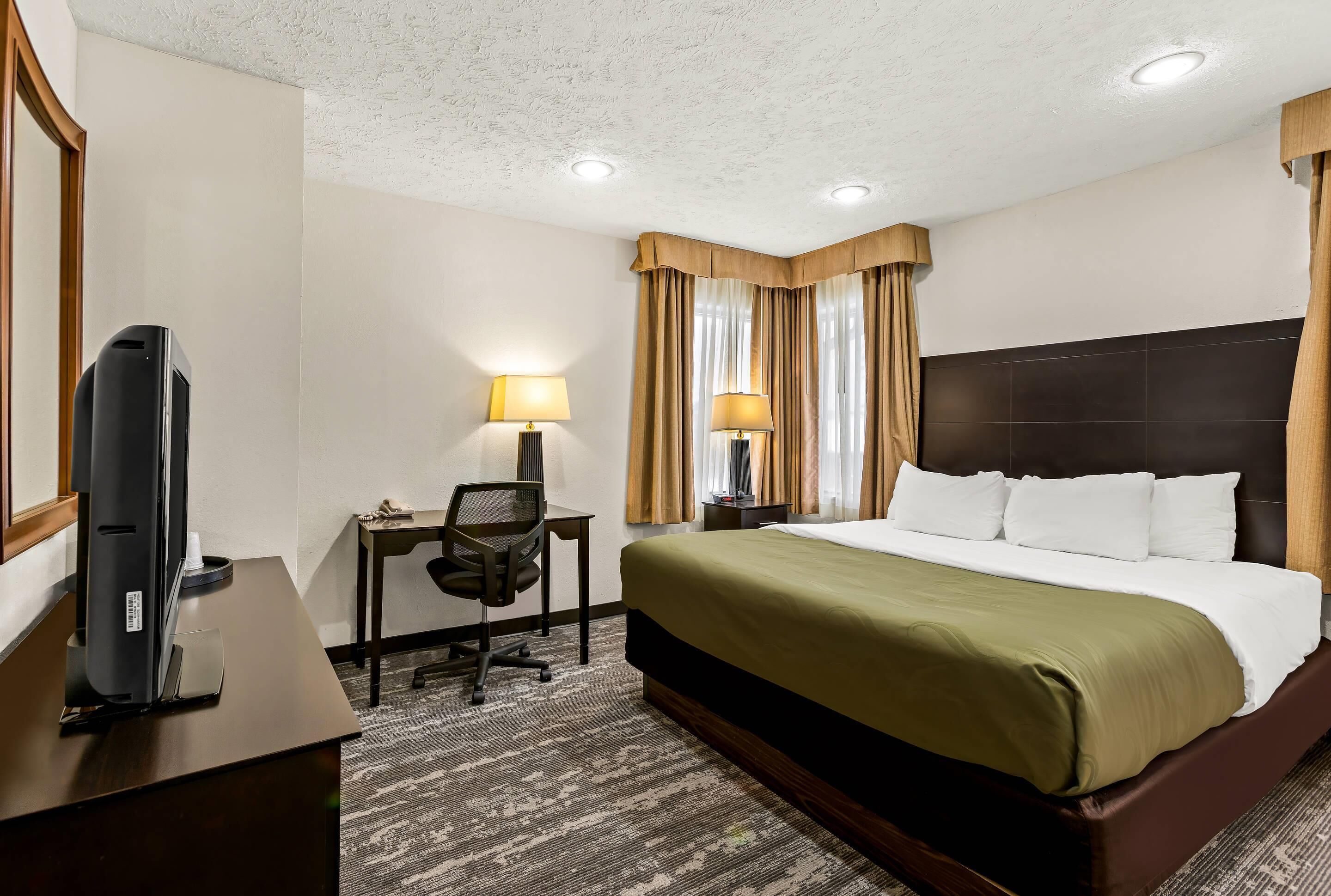 Suite, 1 King Bed, Non Smoking | Blackout drapes, iron/ironing board, free cribs/infant beds, free WiFi