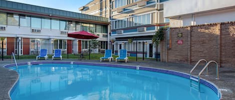 Seasonal outdoor pool, open 9 AM to 7:00 PM, pool umbrellas