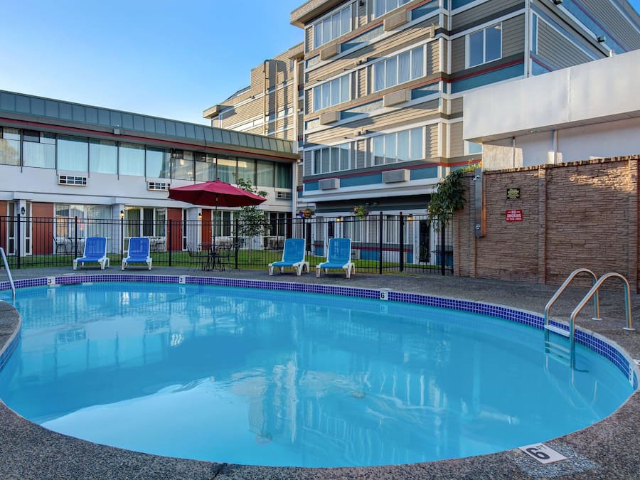 Seasonal outdoor pool, open 9 AM to 7:00 PM, pool umbrellas
