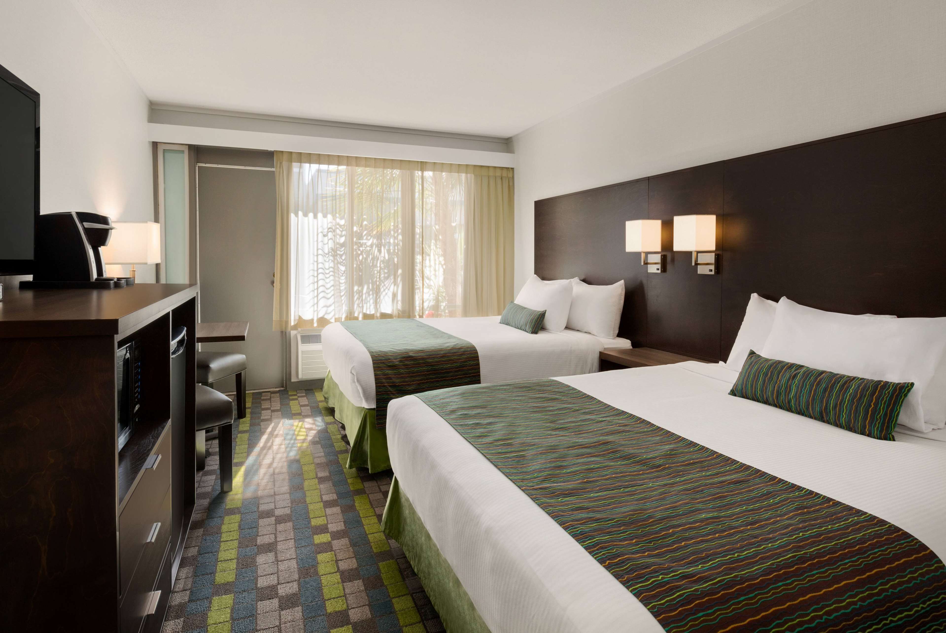 desk, blackout curtains, iron/ironing board, free cots/infant beds