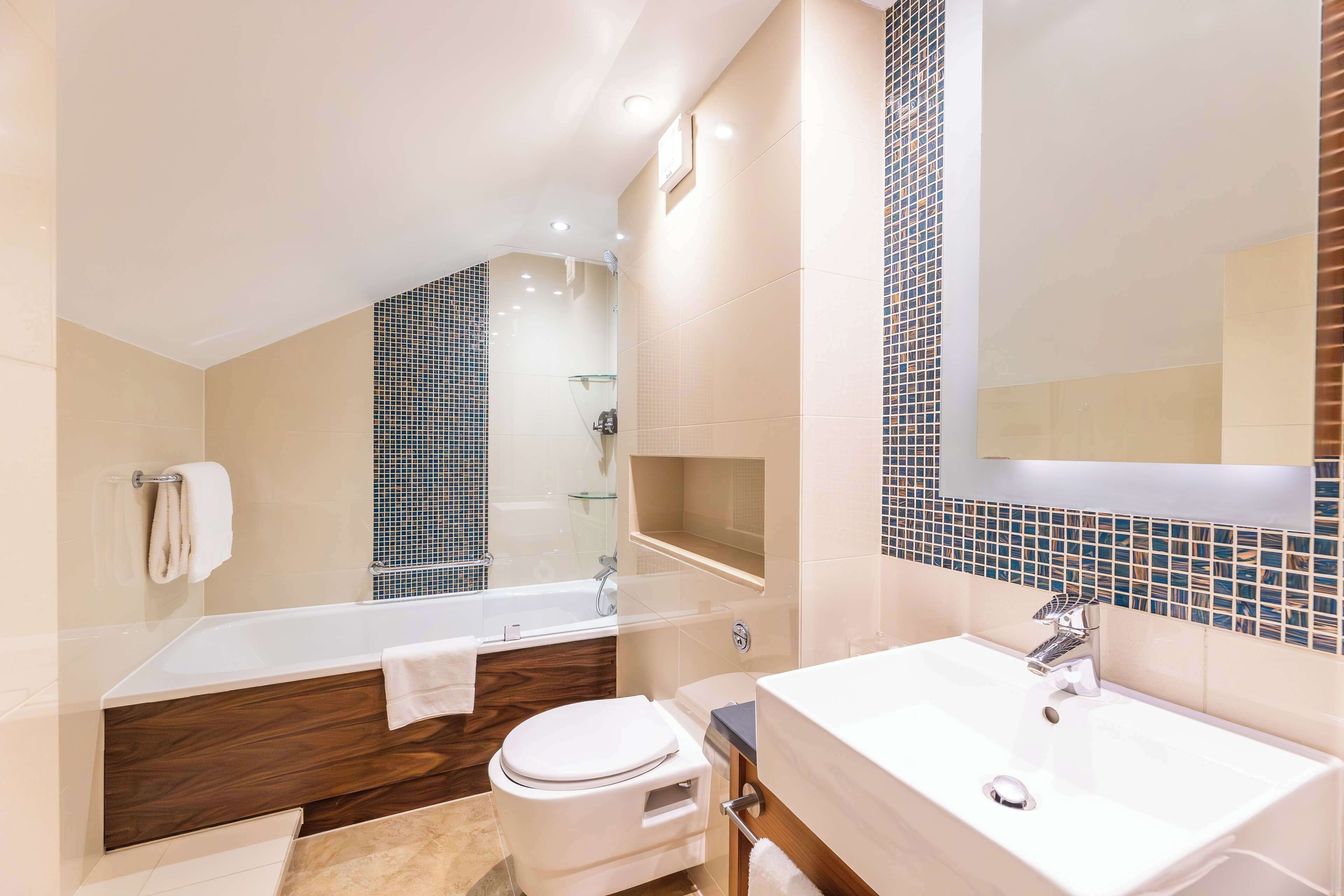 duplex suite | bathroom | free toiletries, hair dryer, slippers, towels