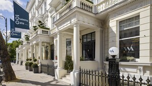 A row of Queen's Gate London buildings with classical architecture, large windows, and a black wrought iron fence. - 100 Queen's Gate Hotel London Kensington, Curio Collection by Hilton (London)