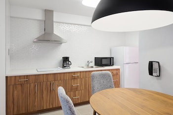 Suite, 2 Bedrooms, Kitchen | Private kitchen | Full-size fridge, microwave, stovetop, coffee/tea maker at Ilima Hotel