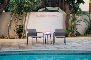 Outdoor pool, open 8:00 AM to 10:00 PM, sun loungers