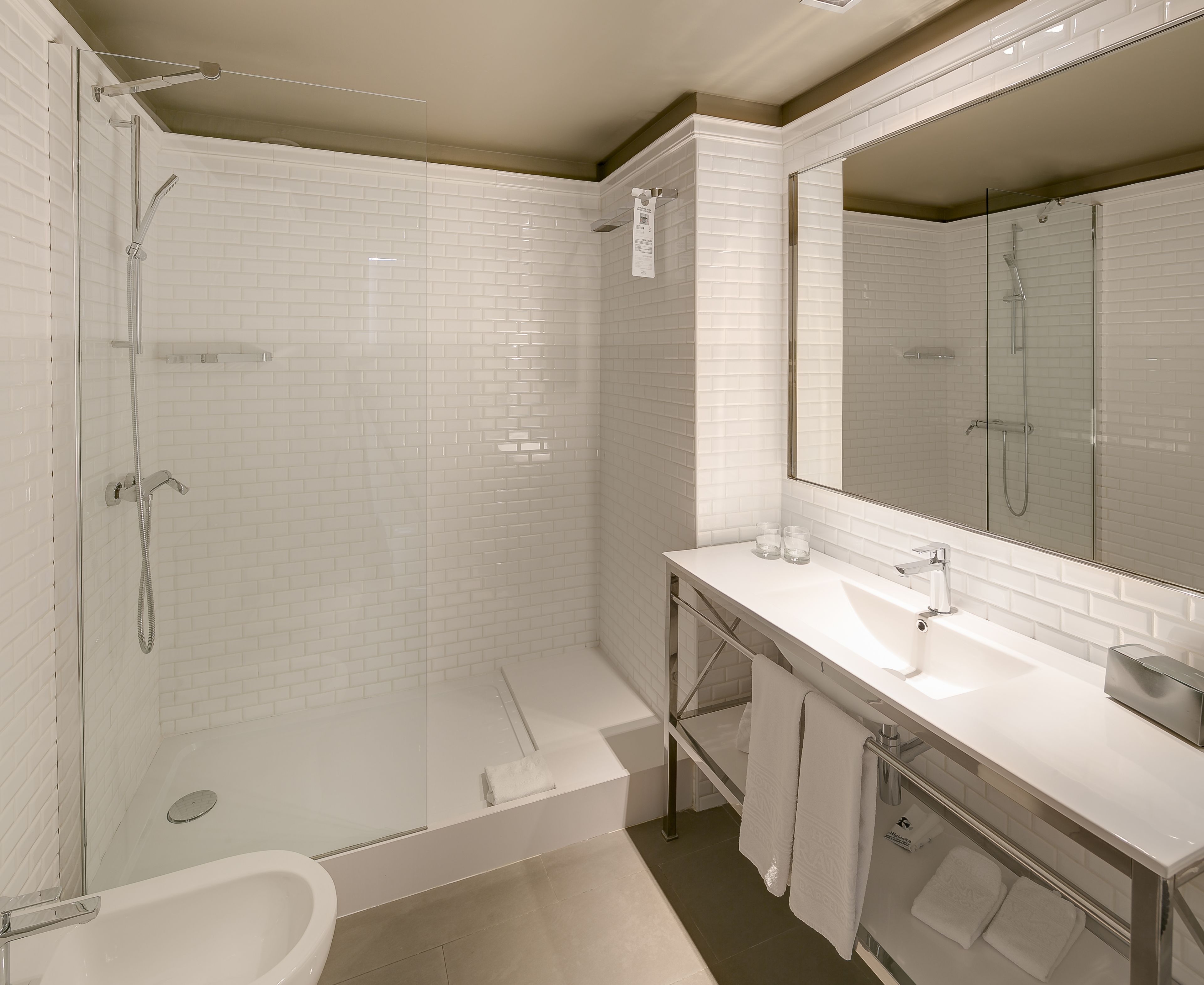 superior room | bathroom | hair dryer, slippers, towels, soap