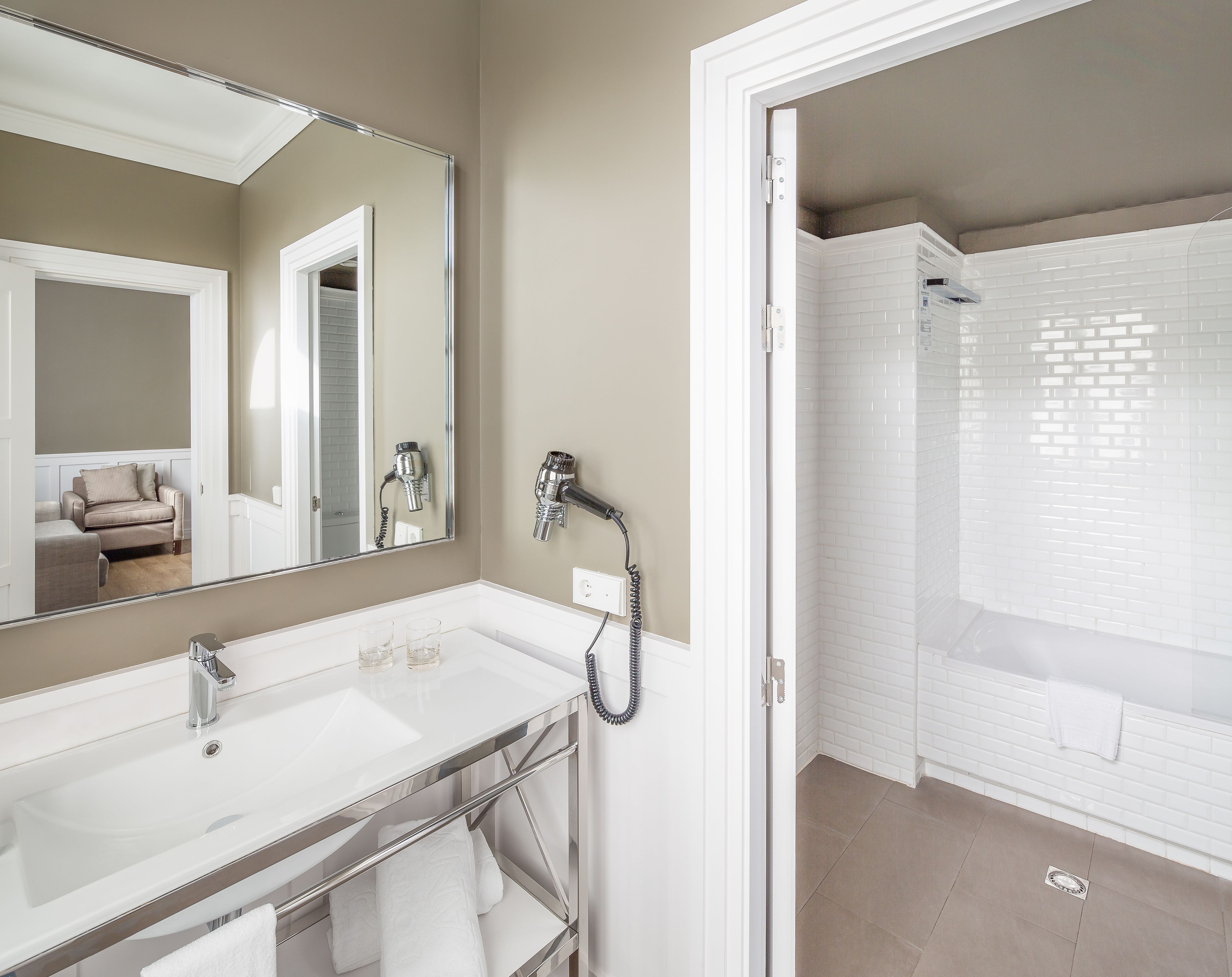 quadruple room | bathroom | hair dryer, slippers, towels, soap