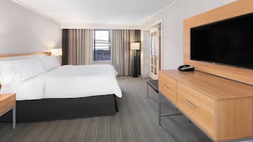 Premium bedding, desk, laptop workspace, iron/ironing board
