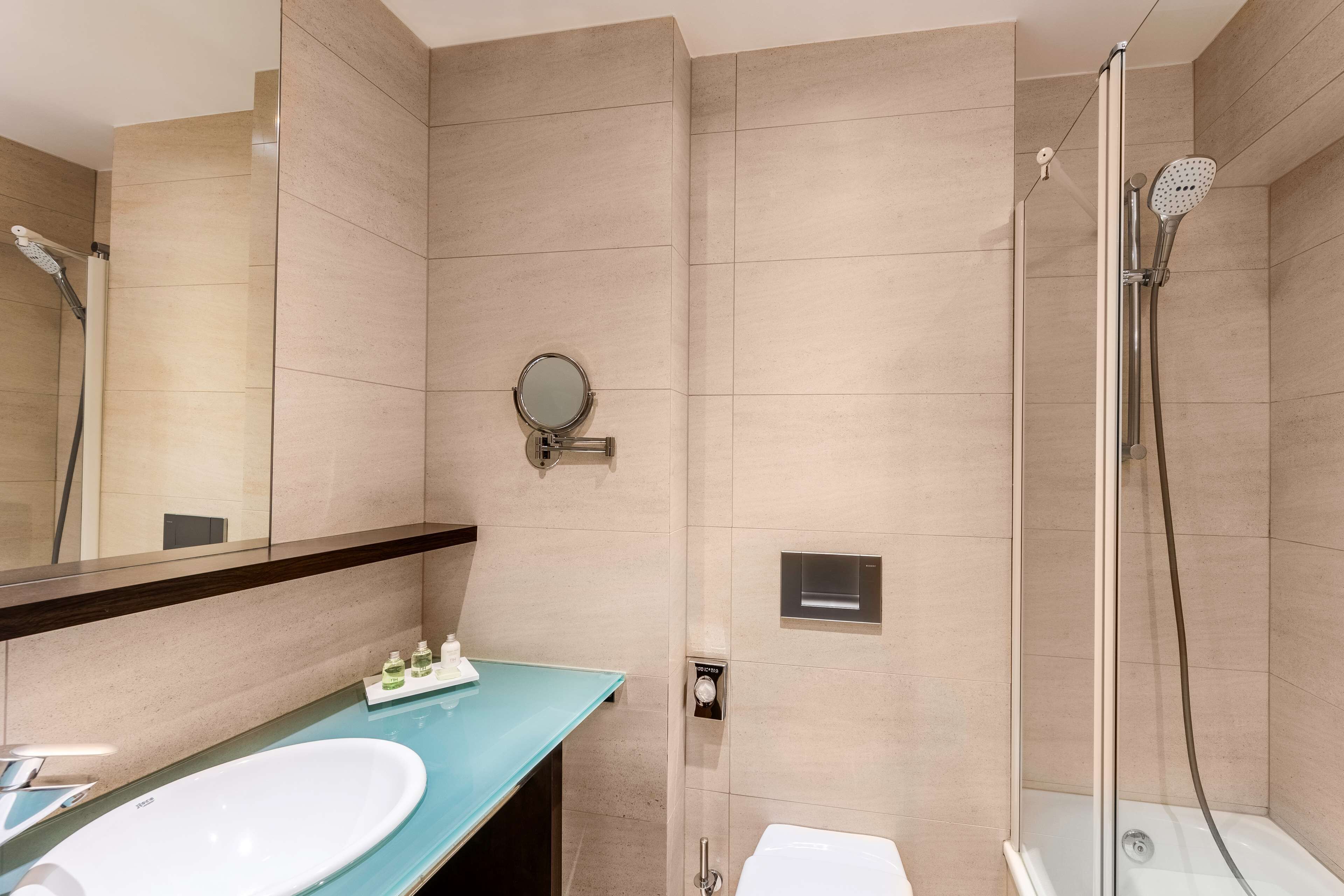 bathtub, eco-friendly toiletries, hair dryer, towels