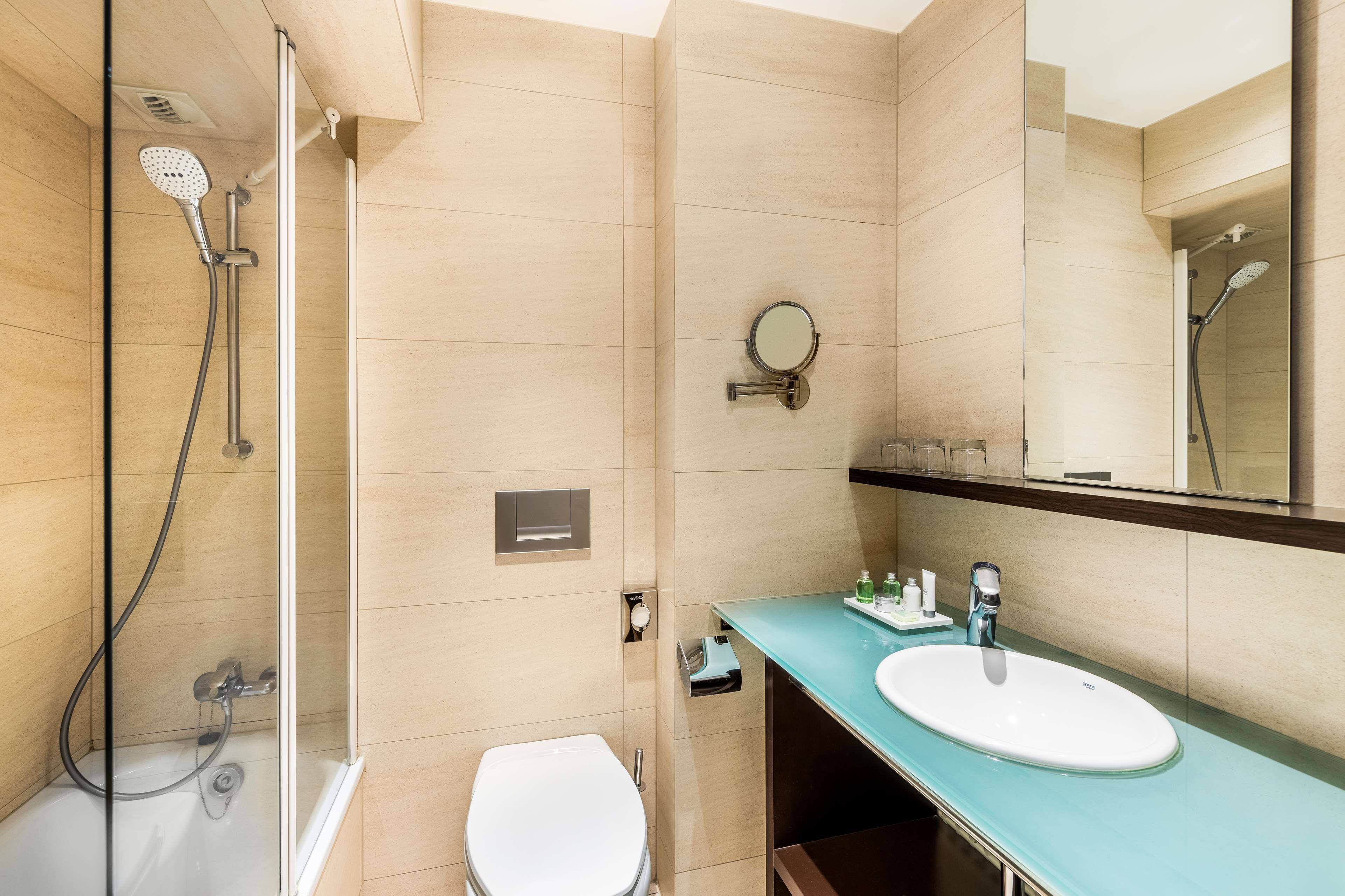 bathtub, eco-friendly toiletries, hair dryer, towels