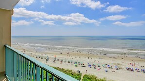 A beach with umbrellas and people. - Sand Dunes Resort and Suites (Myrtle Beach)