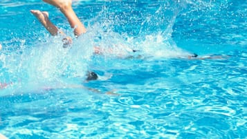 Seasonal outdoor pool, open 10:00 AM to 8:00 PM, pool umbrellas