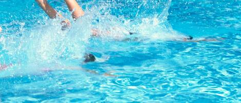 Seasonal outdoor pool, open 10:00 AM to 8:00 PM, pool umbrellas