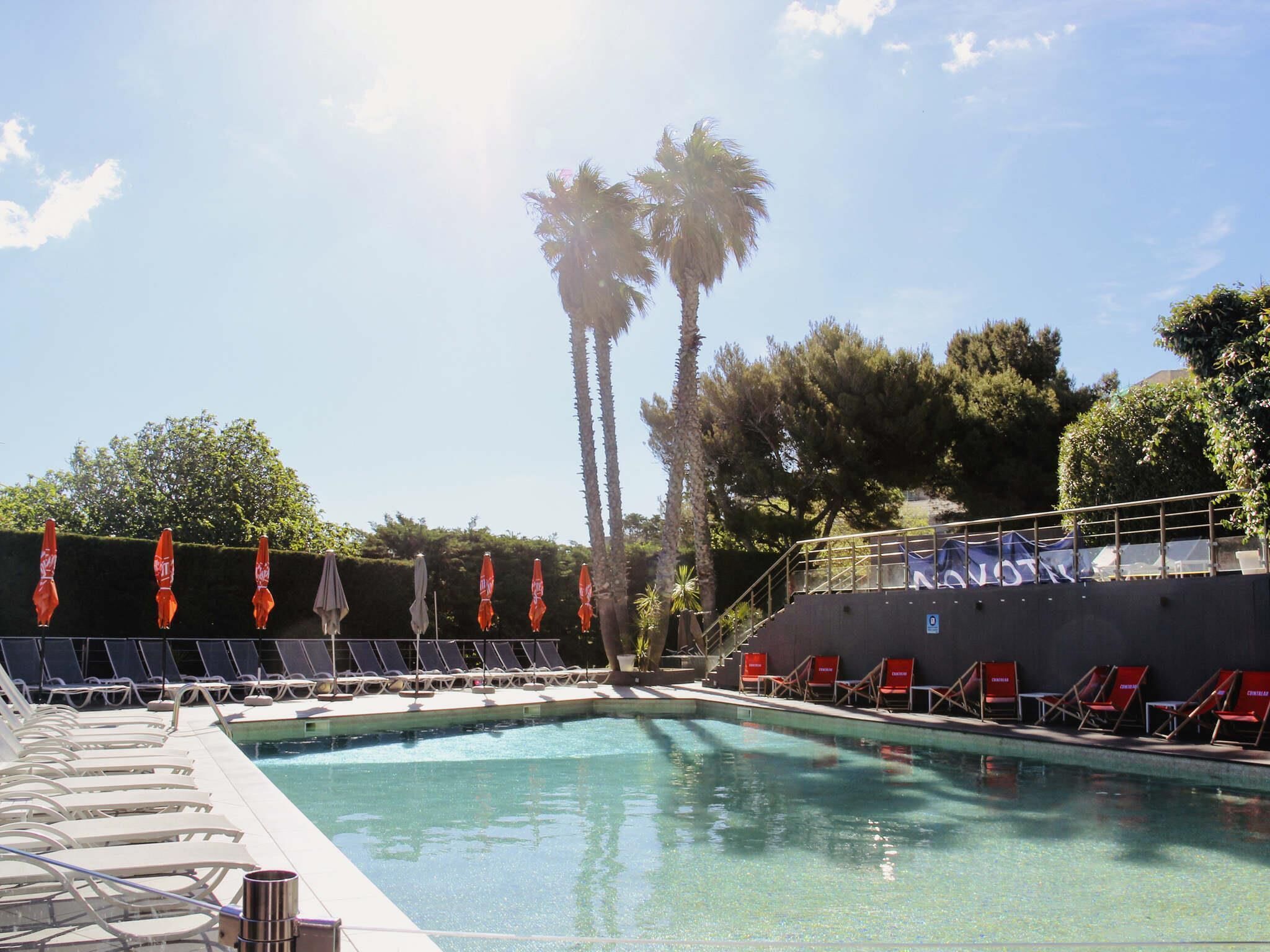 Seasonal outdoor pool, open 8:00 AM to 8:00 PM, pool umbrellas