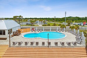 Outdoor pool, open 9:00 AM to 10:00 PM, pool loungers