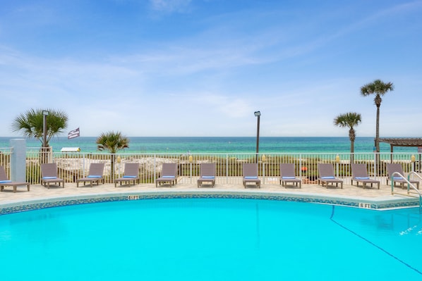 Outdoor pool, open 9:00 AM to 10:00 PM, pool loungers