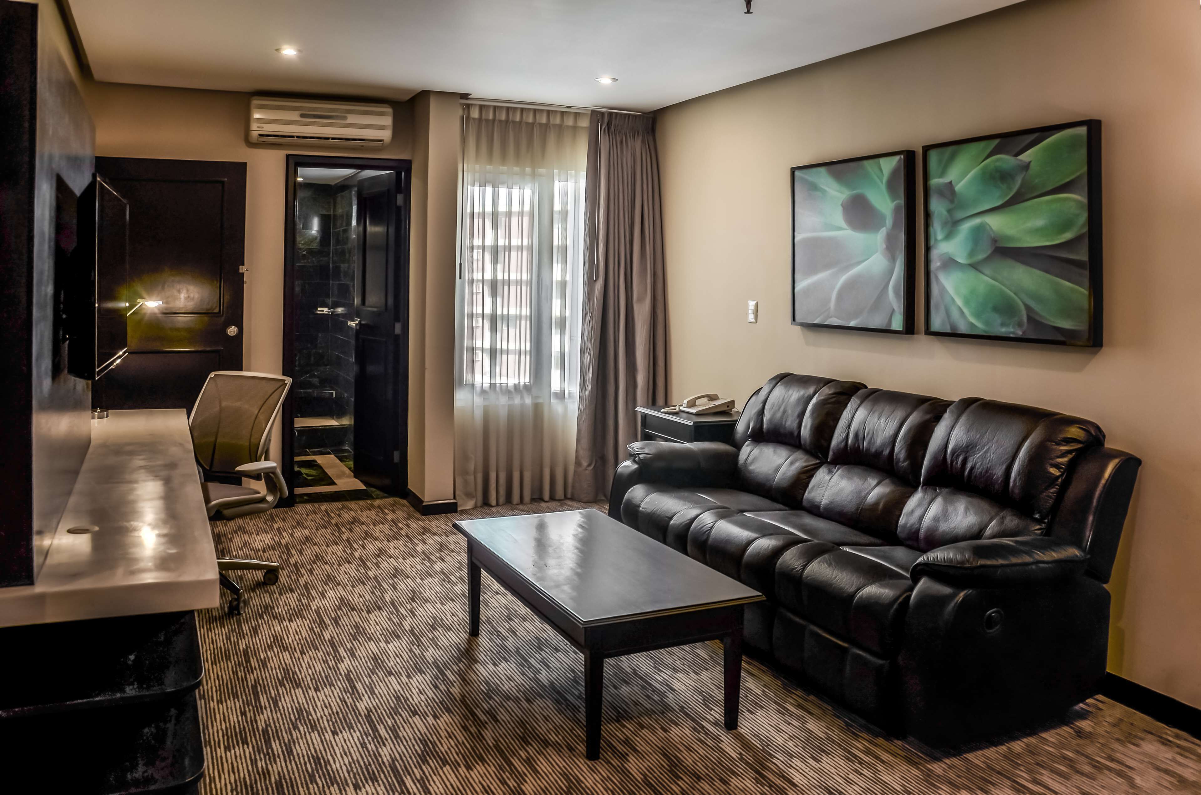 junior suite, 1 king bed | living area | lcd tv