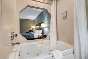 Room, 1 King Bed, Non Smoking, Jetted Tub | Bathroom | Combined shower/tub, free toiletries, hair dryer, towels