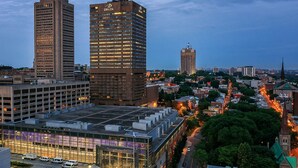 A cityscape with a prominent building labeled "DELTA" and another tall building. - Delta Hotels by Marriott Quebec (Québec City)