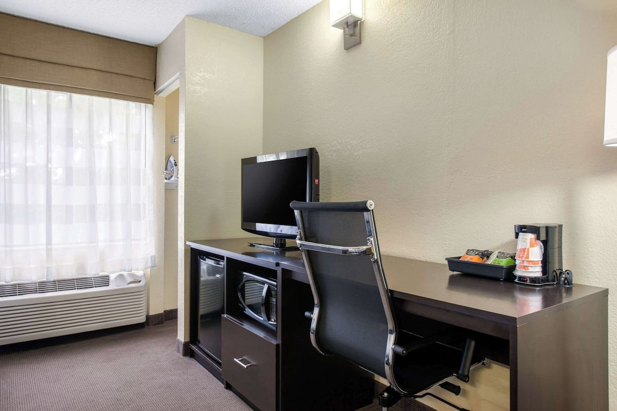 premium bedding, desk, laptop workspace, blackout curtains