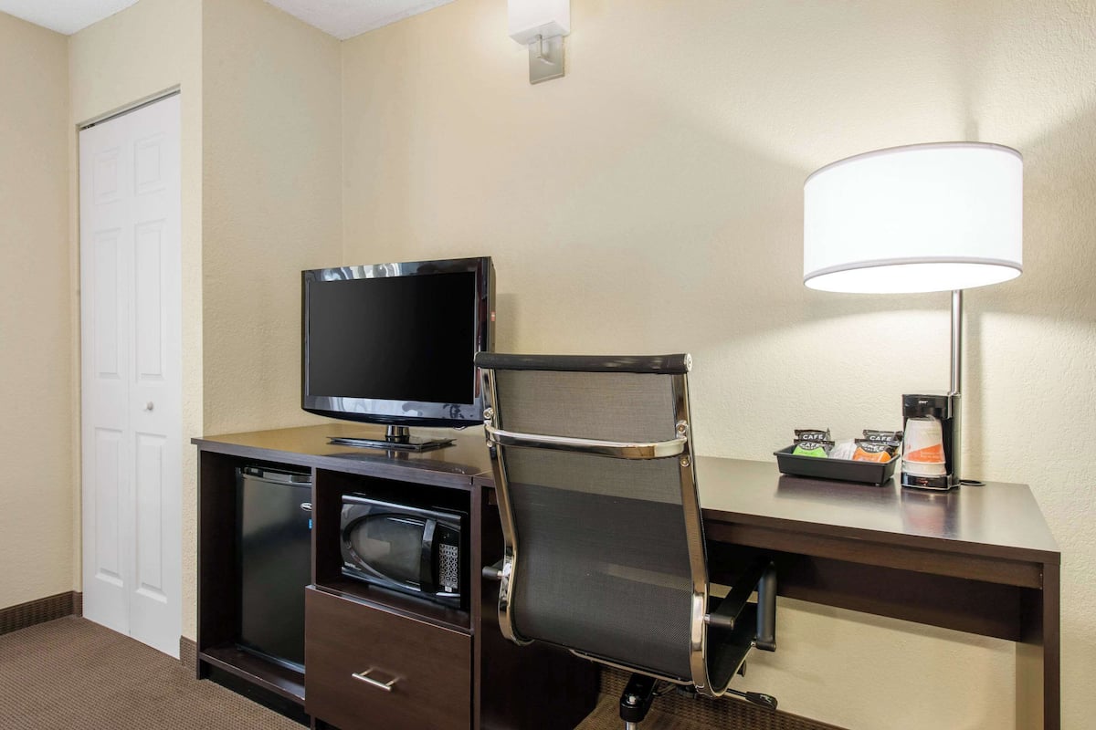 premium bedding, desk, laptop workspace, blackout curtains