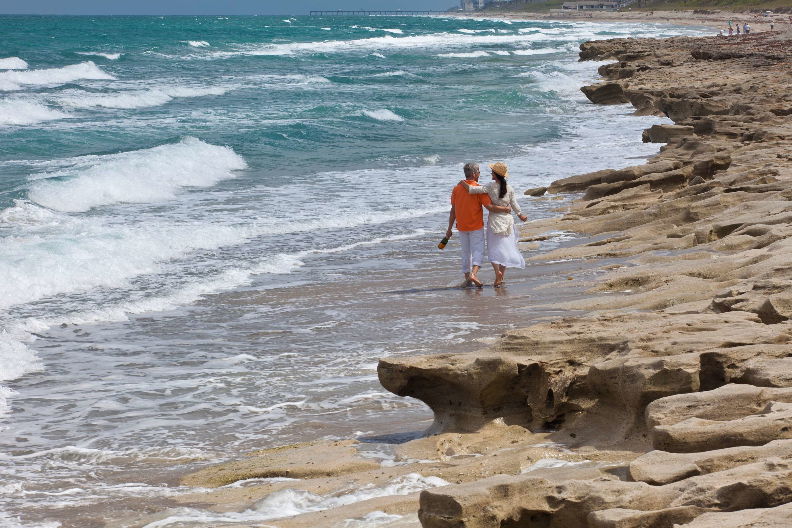 A rocky beach with waves crashing onto the shore.