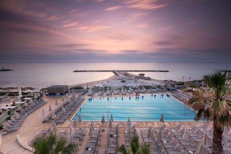 Outdoor pool, open 7:00 AM to 6:30 PM, cabanas (surcharge)