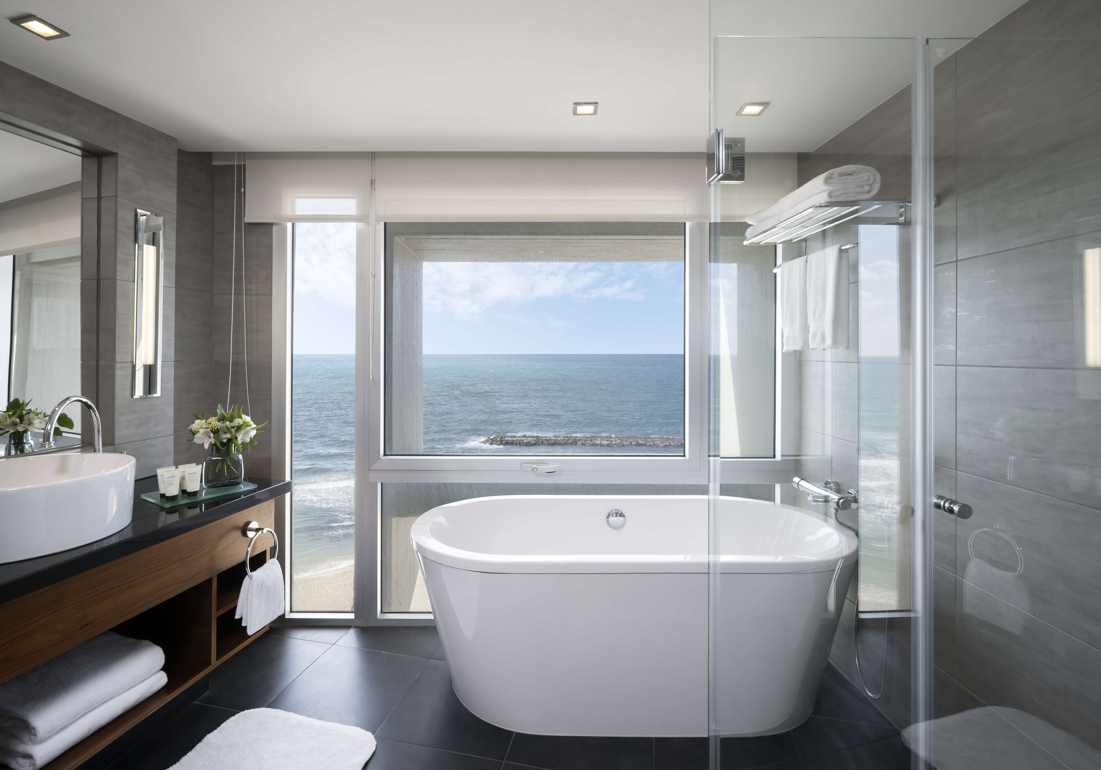 king grand room with sea view | bathroom | separate bathtub and shower, deep-soaking bathtub, designer toiletries
