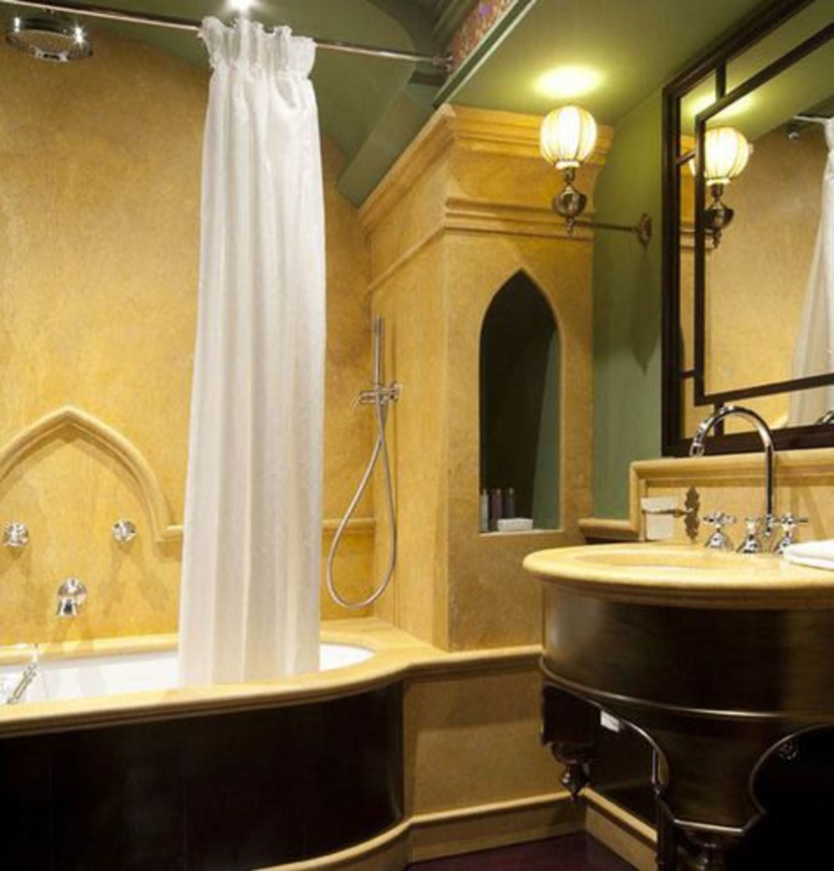 A bathroom with a bathtub, a sink, and a shower.