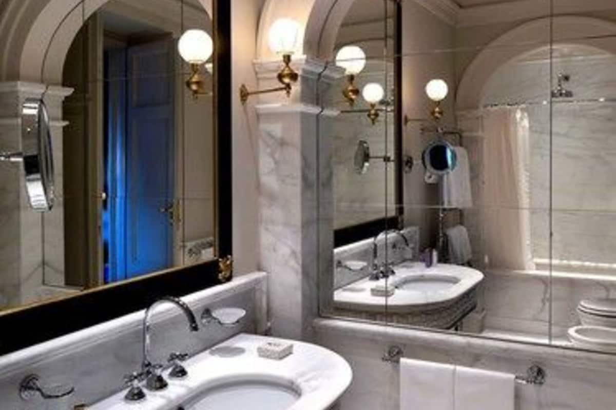 designer toiletries, hair dryer, bathrobes, slippers
